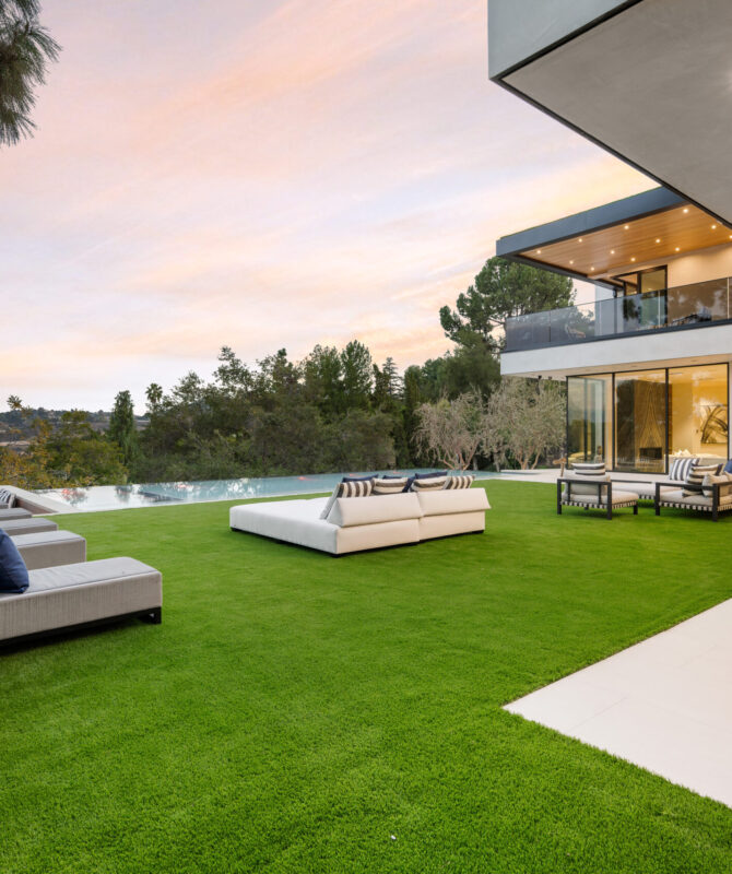 A scenic view of an outdoor patio surrounded by trees.